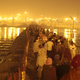 Pilgrims stream across one of many pontoon bridges spanning the Ganga river.
